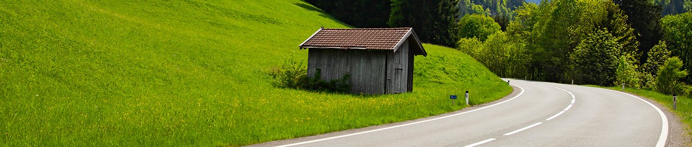 asphalt-road-among-green-meadows-with-bavarian-alp-2022-06-21-22-57-49-utcs