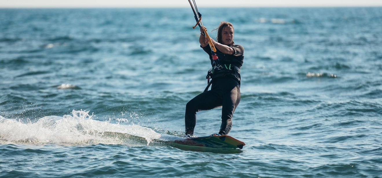 woman-kitesurfing-on-the-ocean-waters-2022-04-16-16-18-33-utc