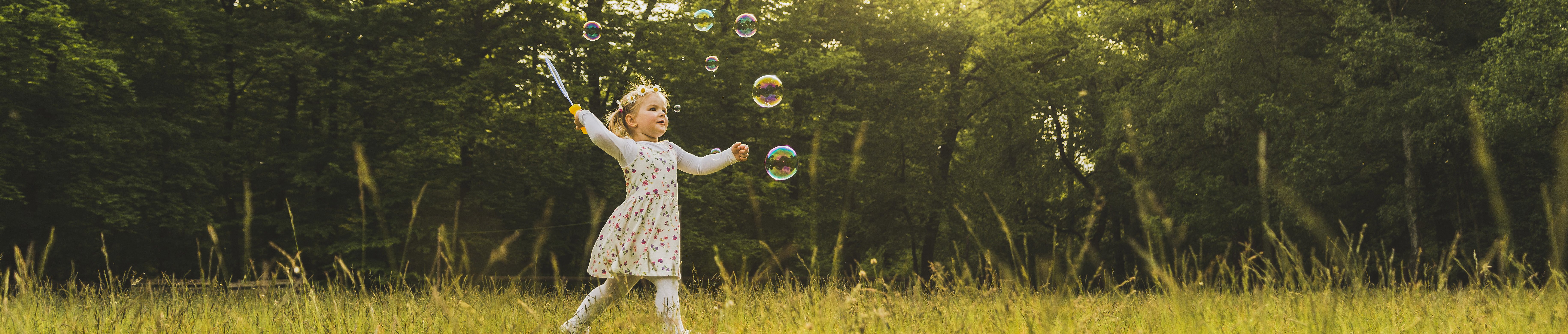 girl-on-meadow-surrounded-by-soap-bubbles-2022-12-16-22-33-13-utc